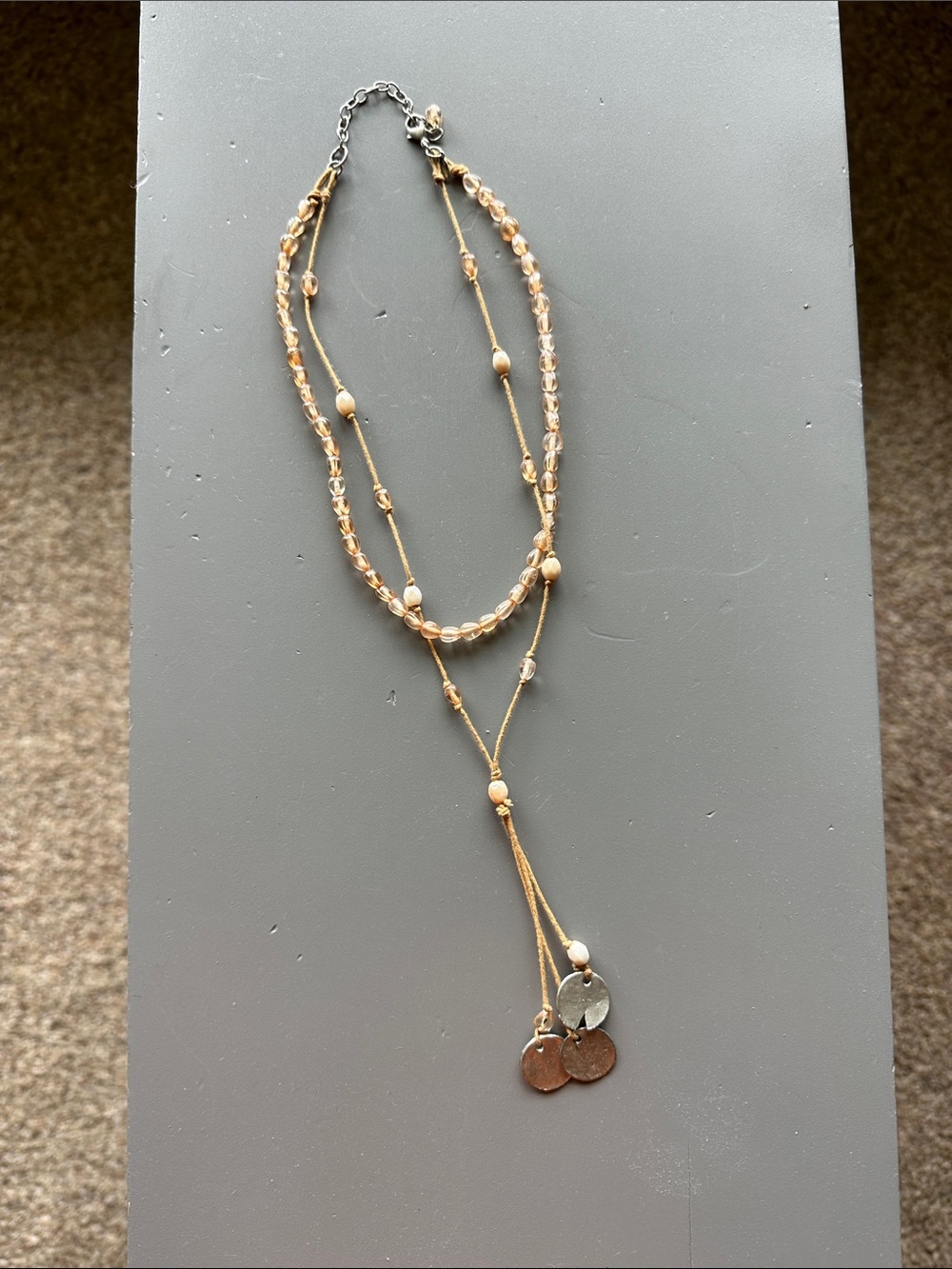 Delicate Beige Multi-Strand Beaded Necklace with Tassel Charms